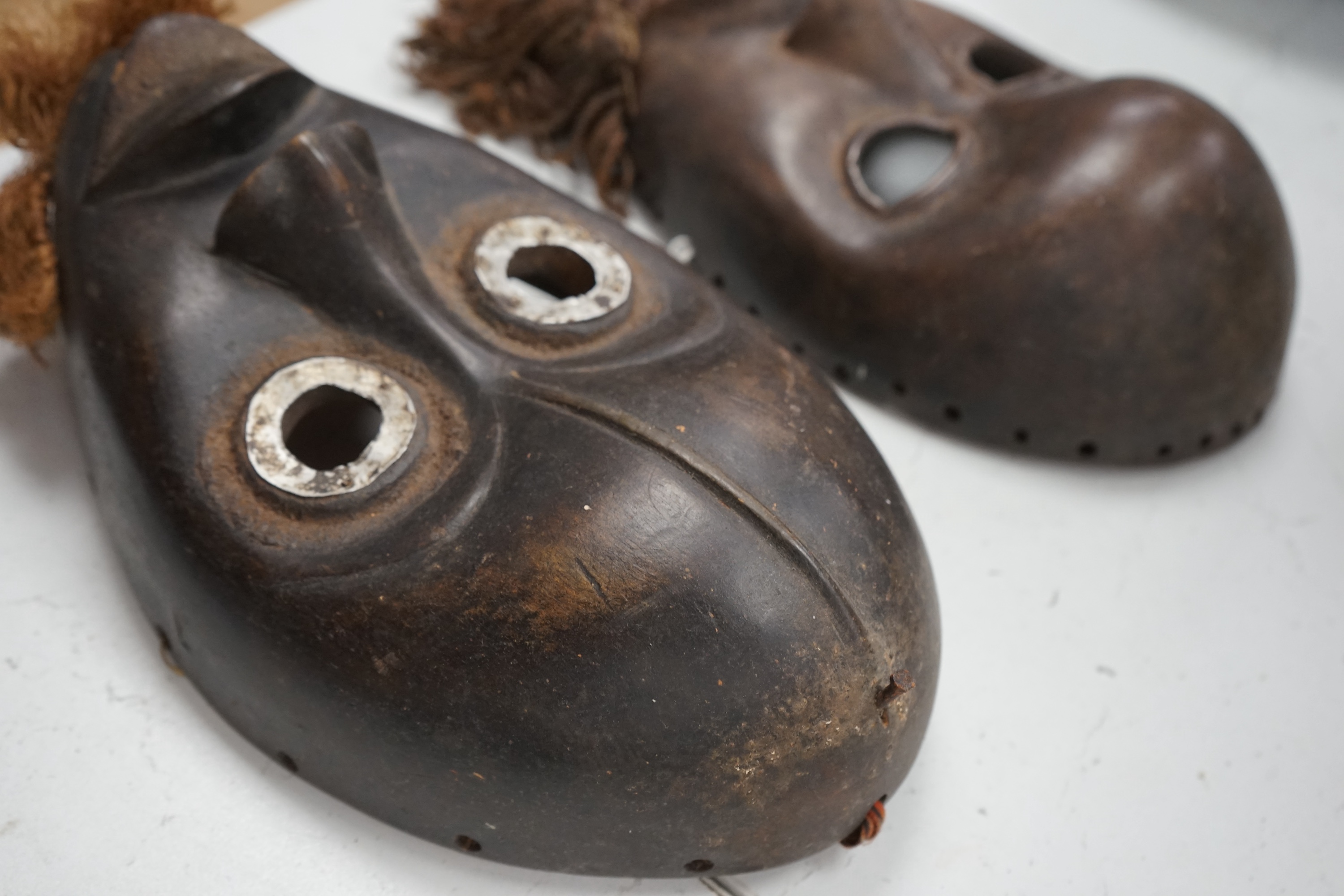 Two African Ivory Coast/Liberian Dan masks, 23cm high. Condition - fair